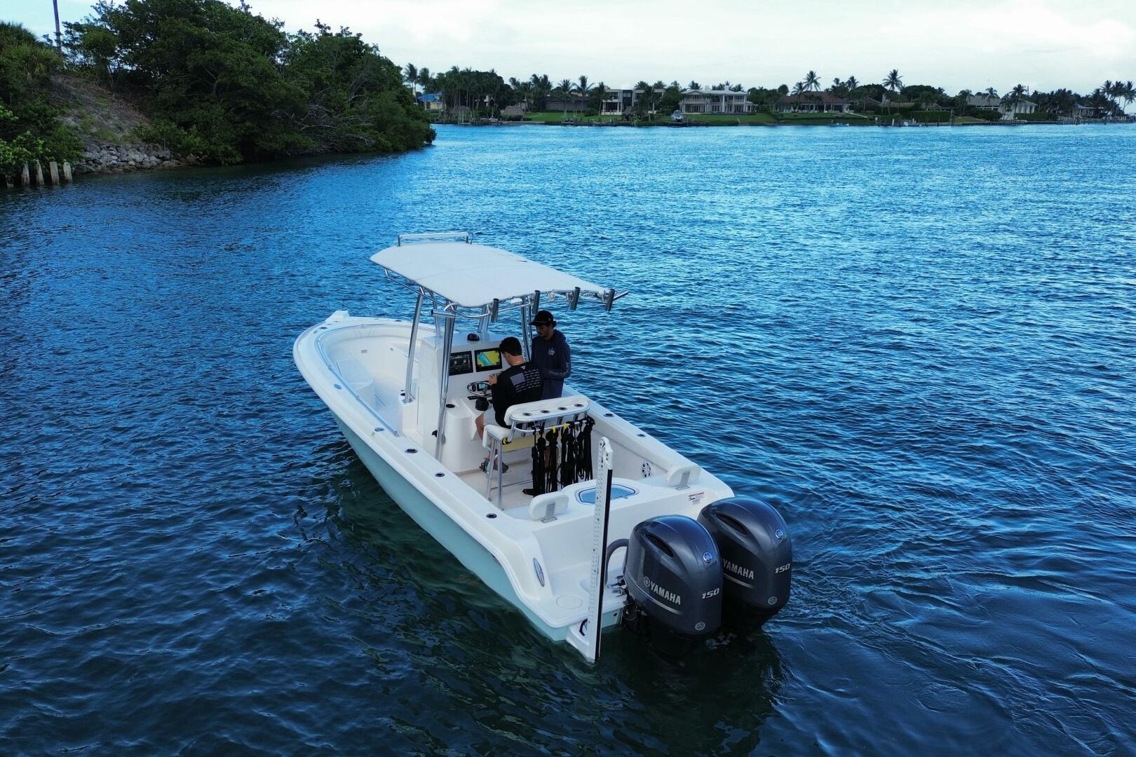 2023 Contender 24 Sport boat on blue water with dual Yamaha 