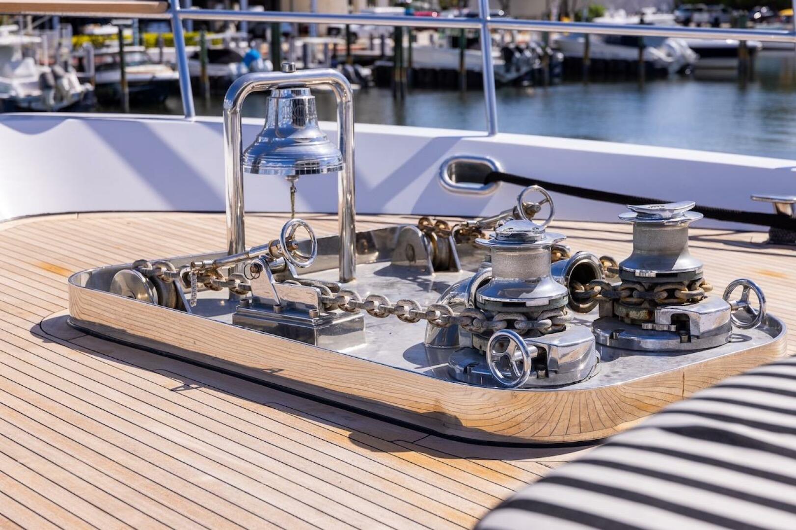 Polished yacht deck with anchor winch and bell, ABD 90 Explo