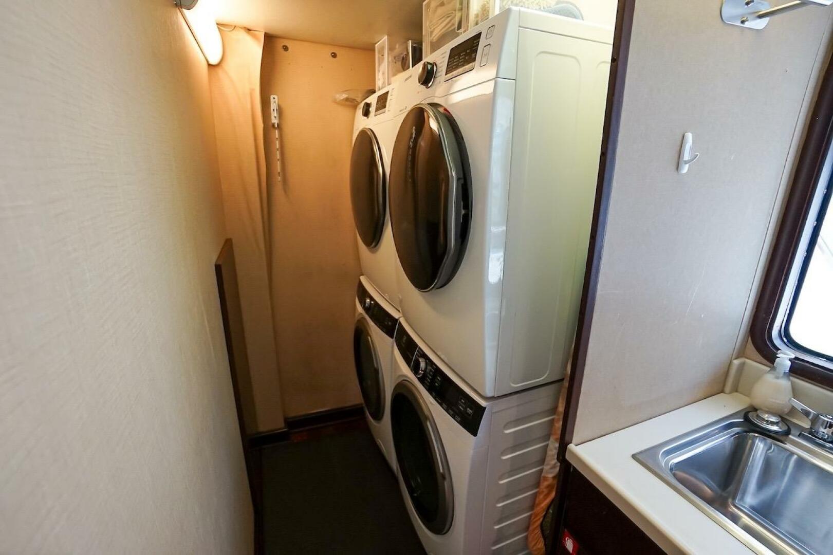 Stacked washer and dryer in 1996 ABD 90 Explorer RV interior