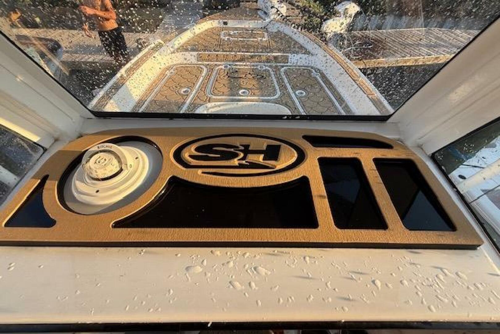 2018 Sea Hunt BX 25 FS boat dashboard with SH logo and water