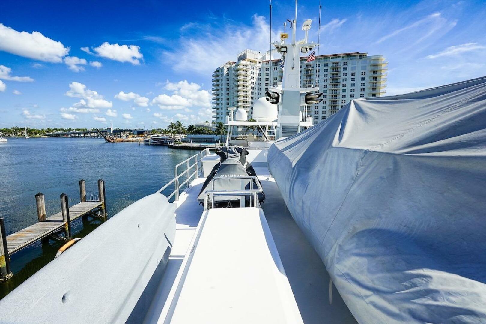 Bow of 1996 ABD 90 Explorer yacht with cityscape and waterfr