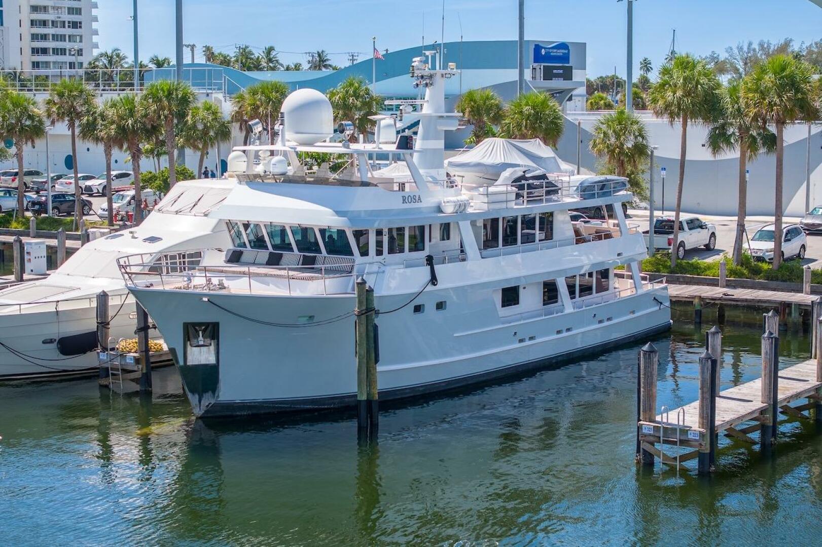 Luxury yacht ABD 90 Explorer 1996 docked at marina with palm