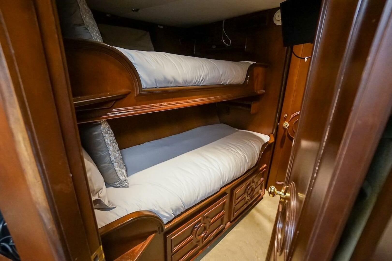 Bunk beds in a 1996 ABD 90 Explorer yacht cabin with wooden 