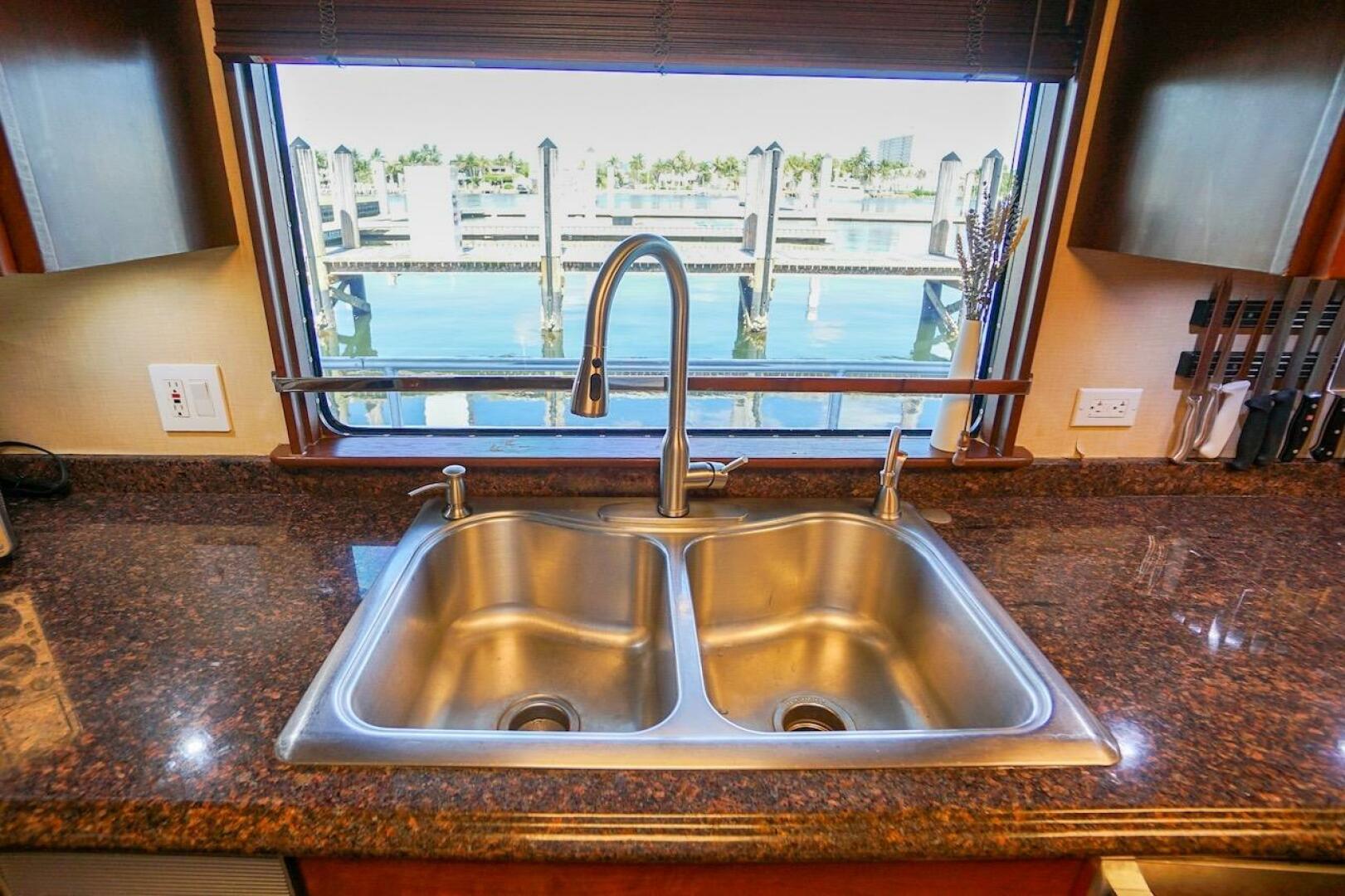 Stainless steel double sink on granite countertop with marin
