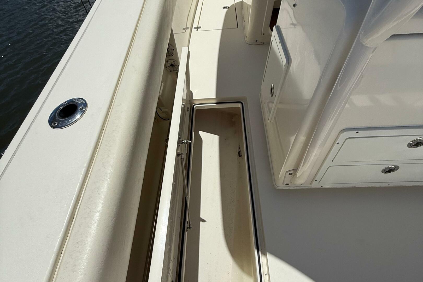 2015 Cobia 296 Center Console boat deck with storage compart