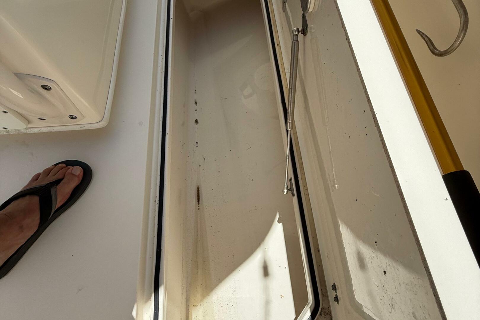 Open storage compartment on 2015 Cobia 296 Center Console bo