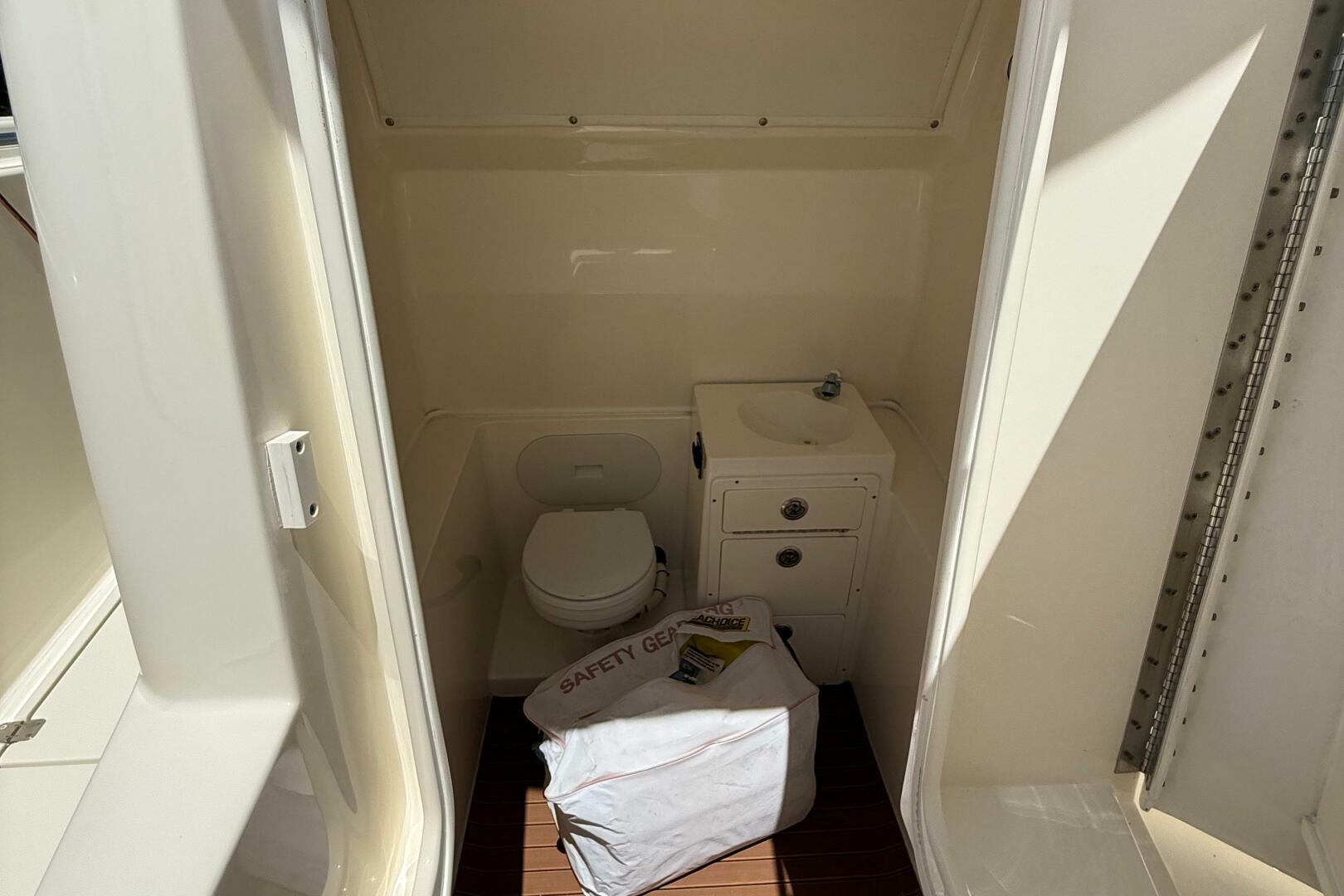 Interior of 2015 Cobia 296 Center Console boat with toilet a