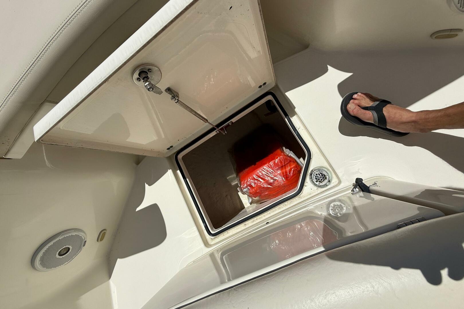 Open storage compartment on 2015 Cobia 296 Center Console bo