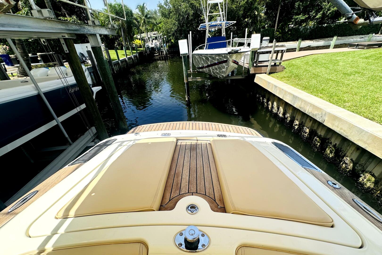 2013 Chris-Craft Corsair 22 docked in a serene canal setting