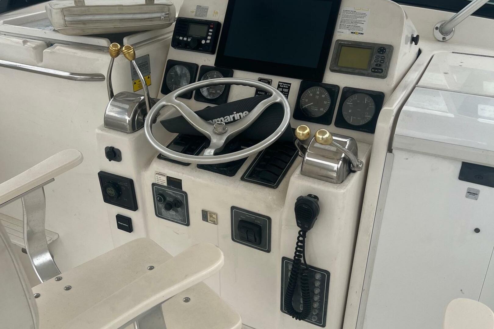 Control panel of a 2001 Pursuit 3000 Offshore boat with stee