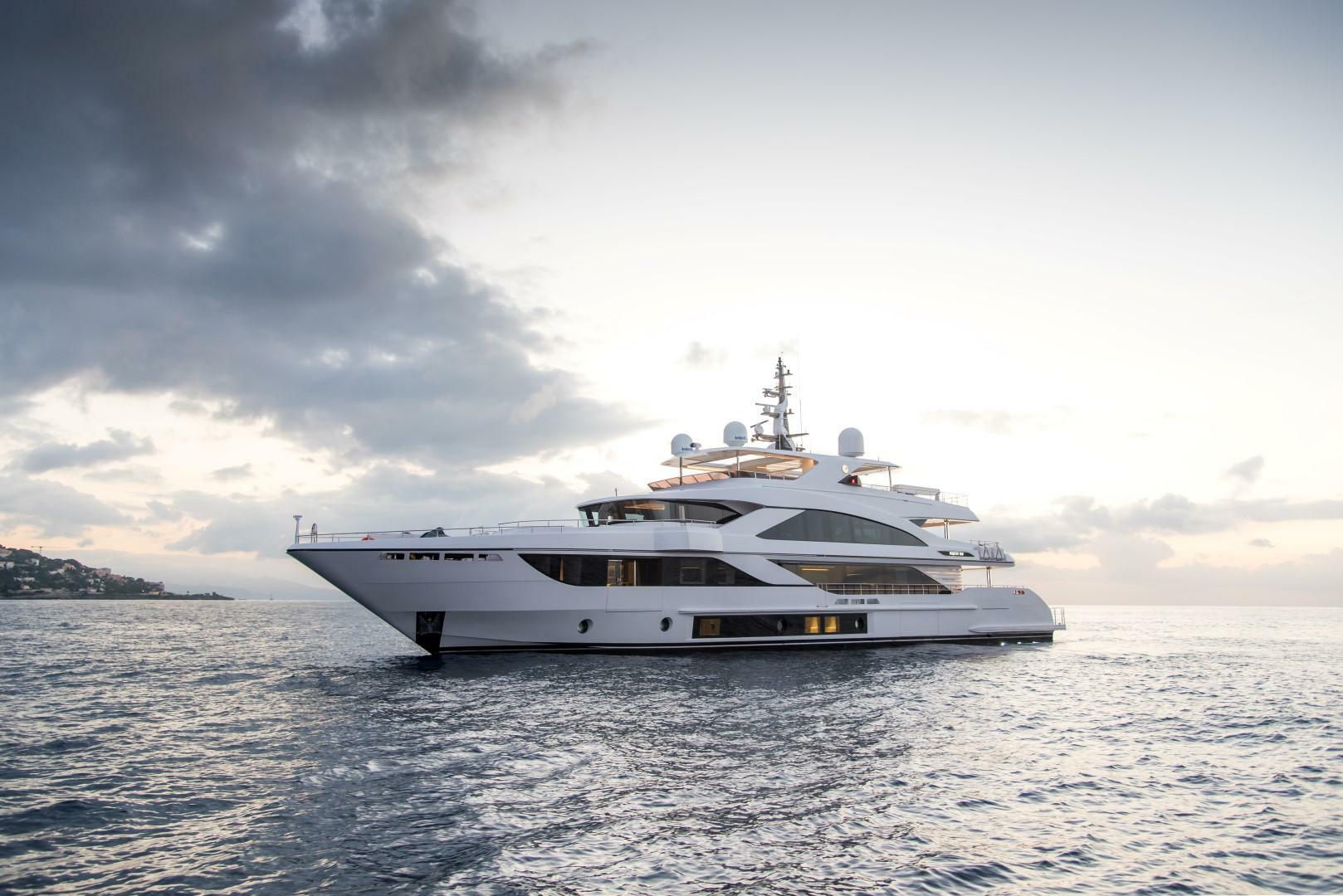 Luxury Majesty 140 yacht cruising at sunset, 2020 model.