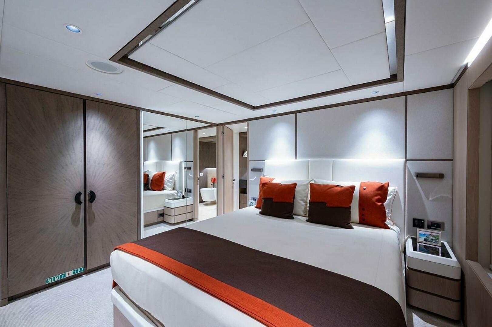 Luxurious bedroom interior on 2020 Majesty 140 yacht with mo