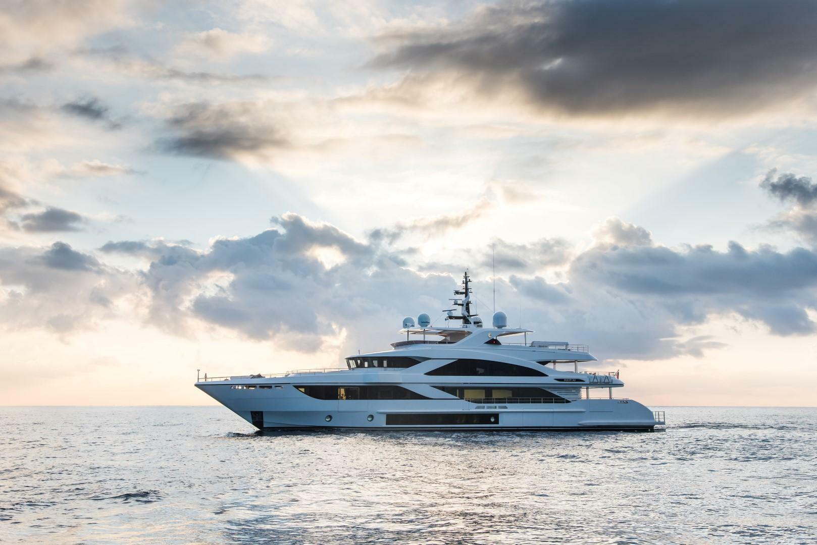 Luxury Majesty 140 yacht sailing at sunset, 2020 model.