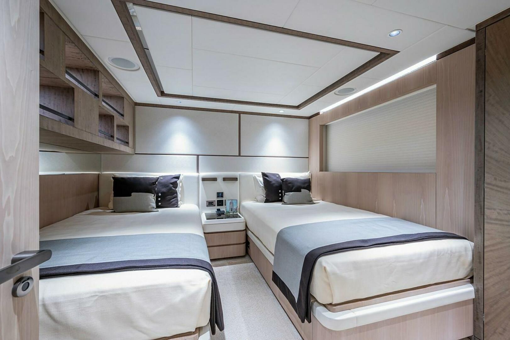 Luxurious twin bedroom in 2020 Majesty 140 yacht, featuring 