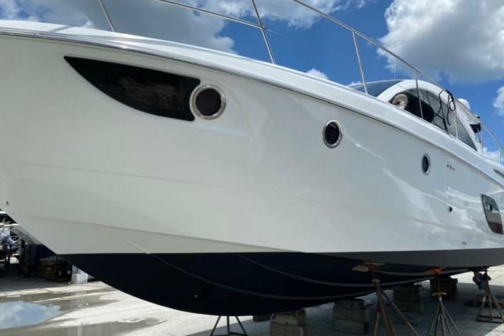 2014 Beneteau Gran Turismo 44 yacht on dry dock under a blue