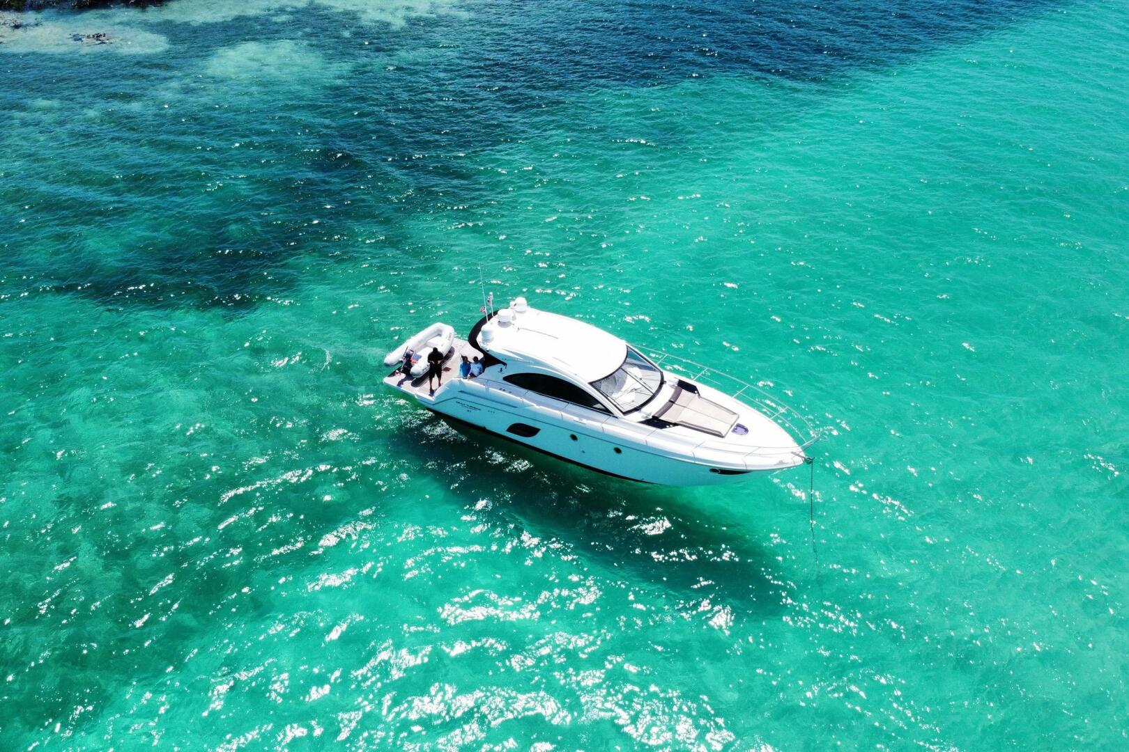 2014 Beneteau Gran Turismo 44 yacht cruising in clear turquo