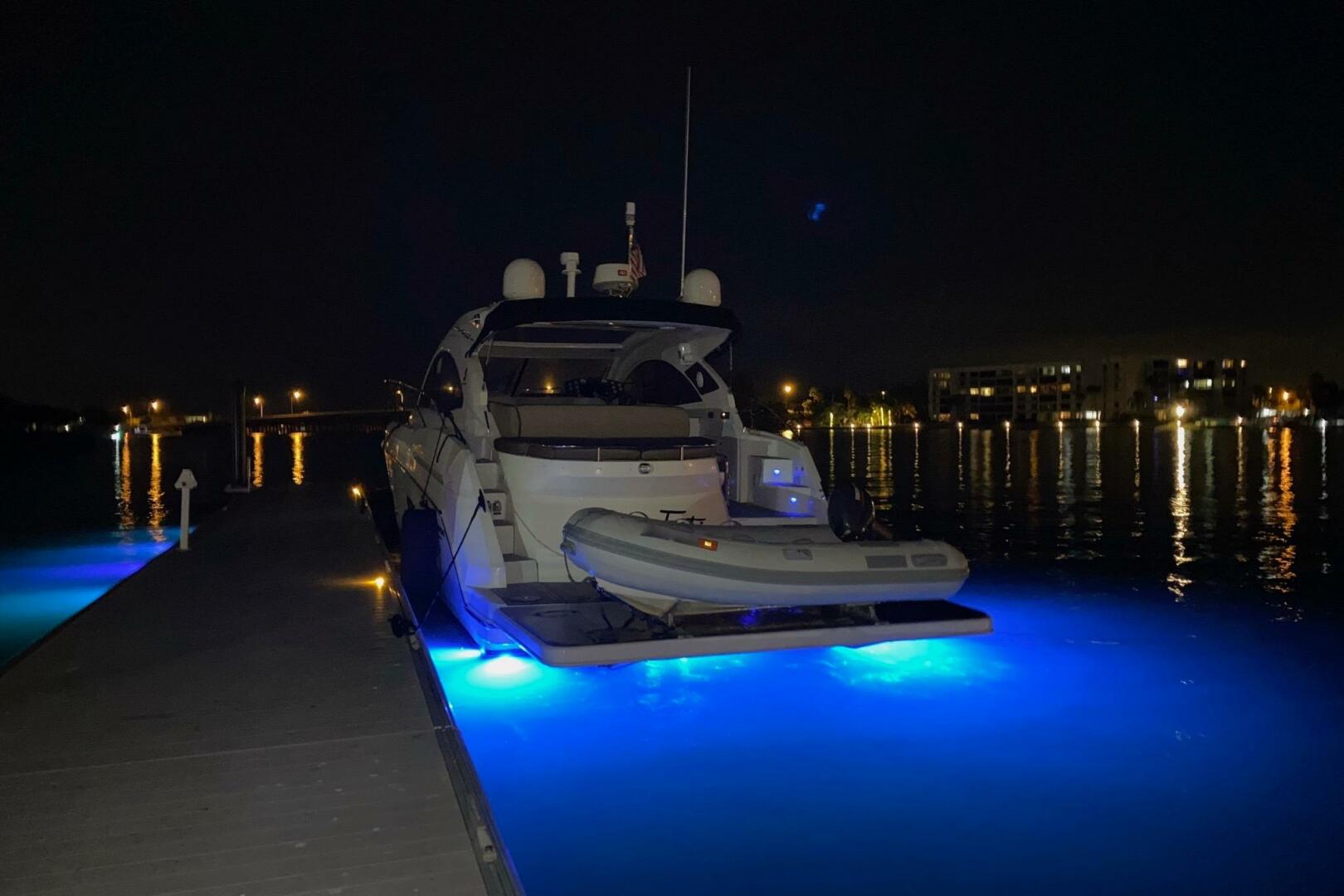 2014 Beneteau Gran Turismo 44 yacht docked at night with blu