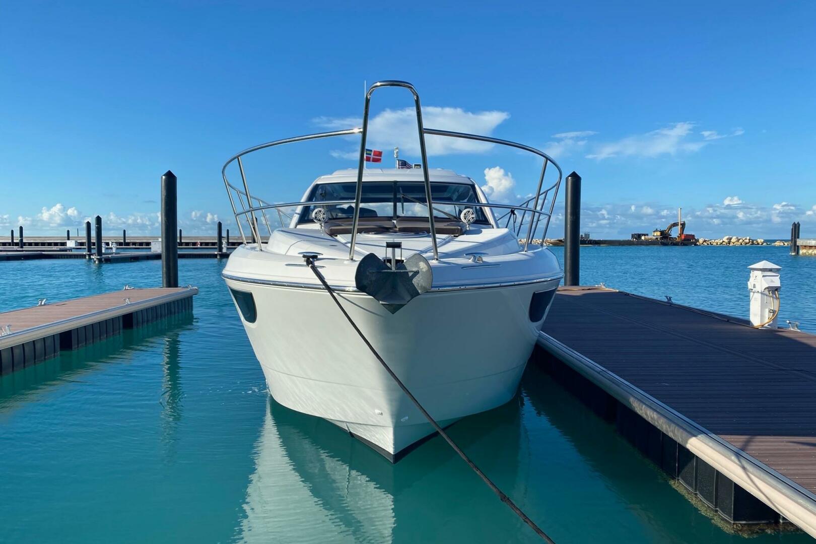 2014 Beneteau Gran Turismo 44 yacht docked in a serene marin