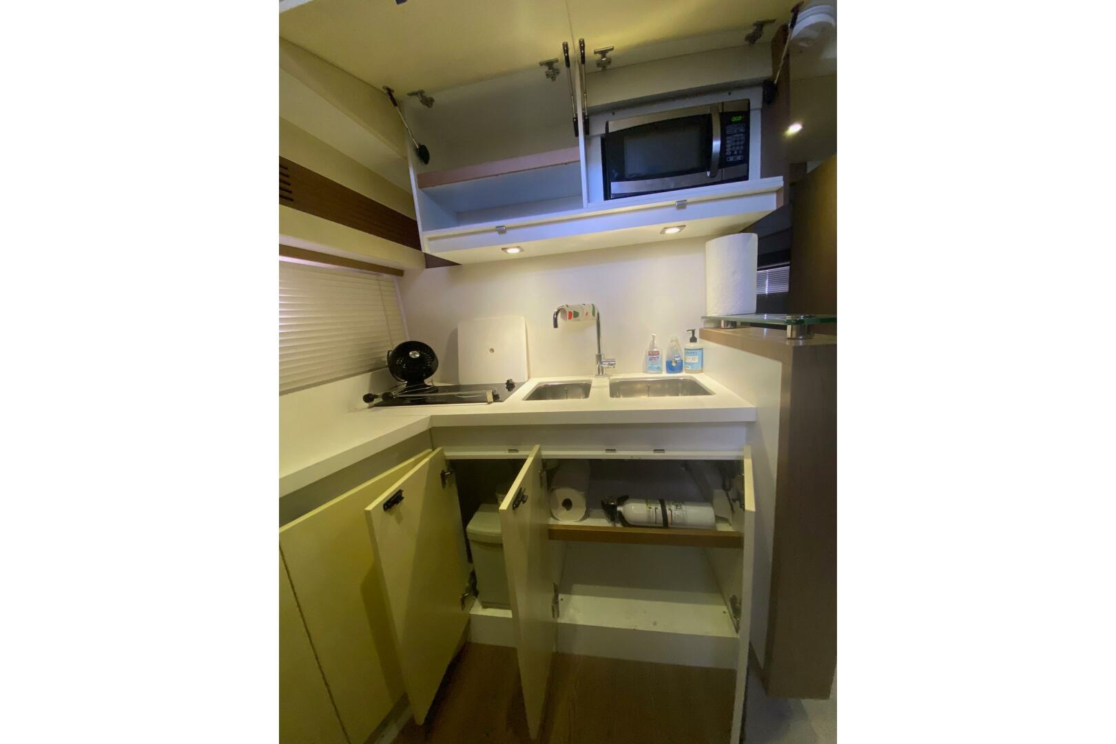 Compact kitchen in 2014 Beneteau Gran Turismo 44 yacht with 