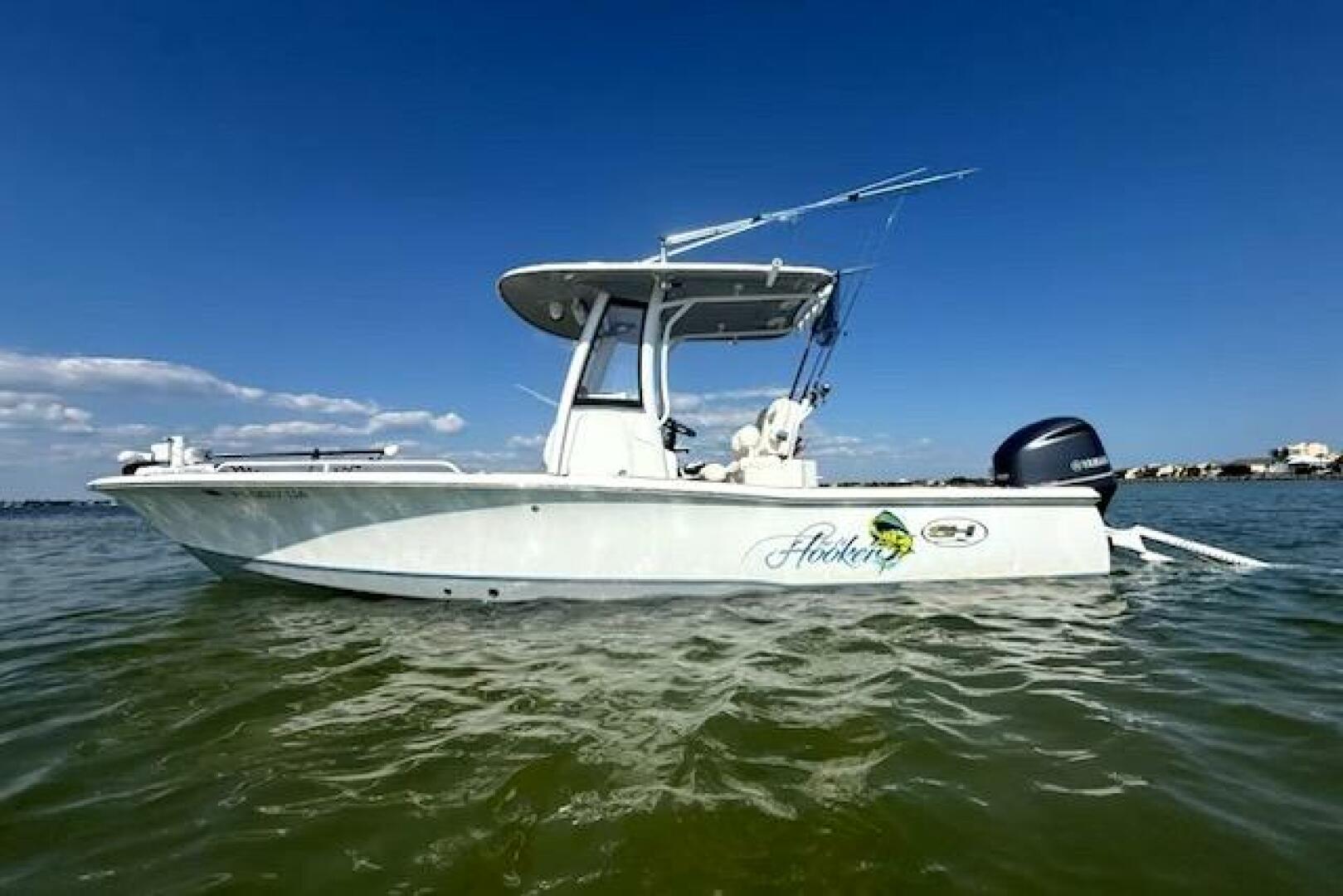2018 Sea Hunt BX 25 FS boat on water under clear blue sky.