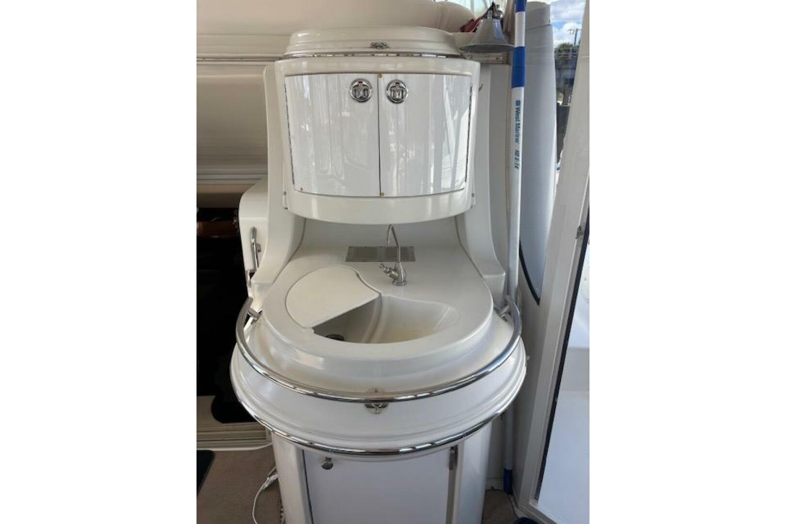 2004 Carver 466 Motor Yacht interior sink with storage cabin