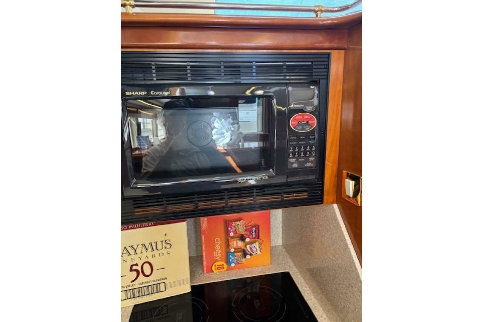 Microwave in 2004 Carver 466 Motor Yacht kitchen with snacks