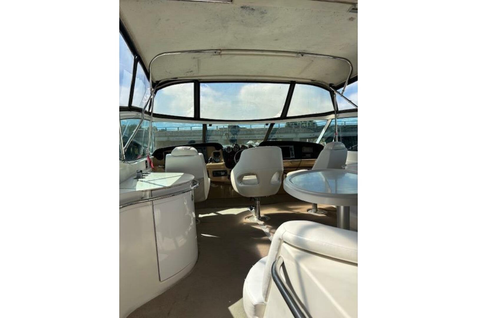 2004 Carver 466 Motor Yacht interior with helm, seating, and