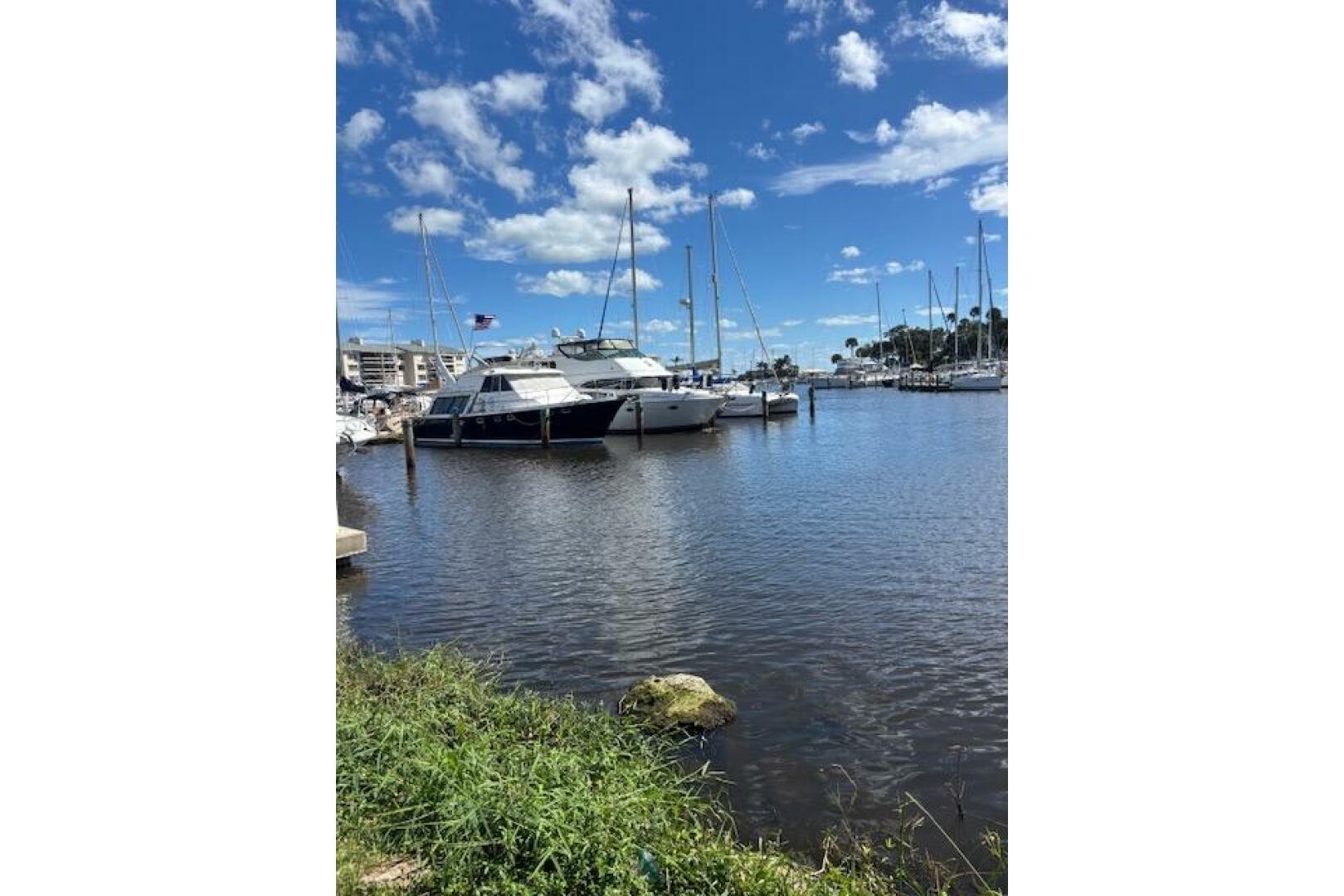 2004 Carver 466 Motor Yacht docked in a sunny marina with bl