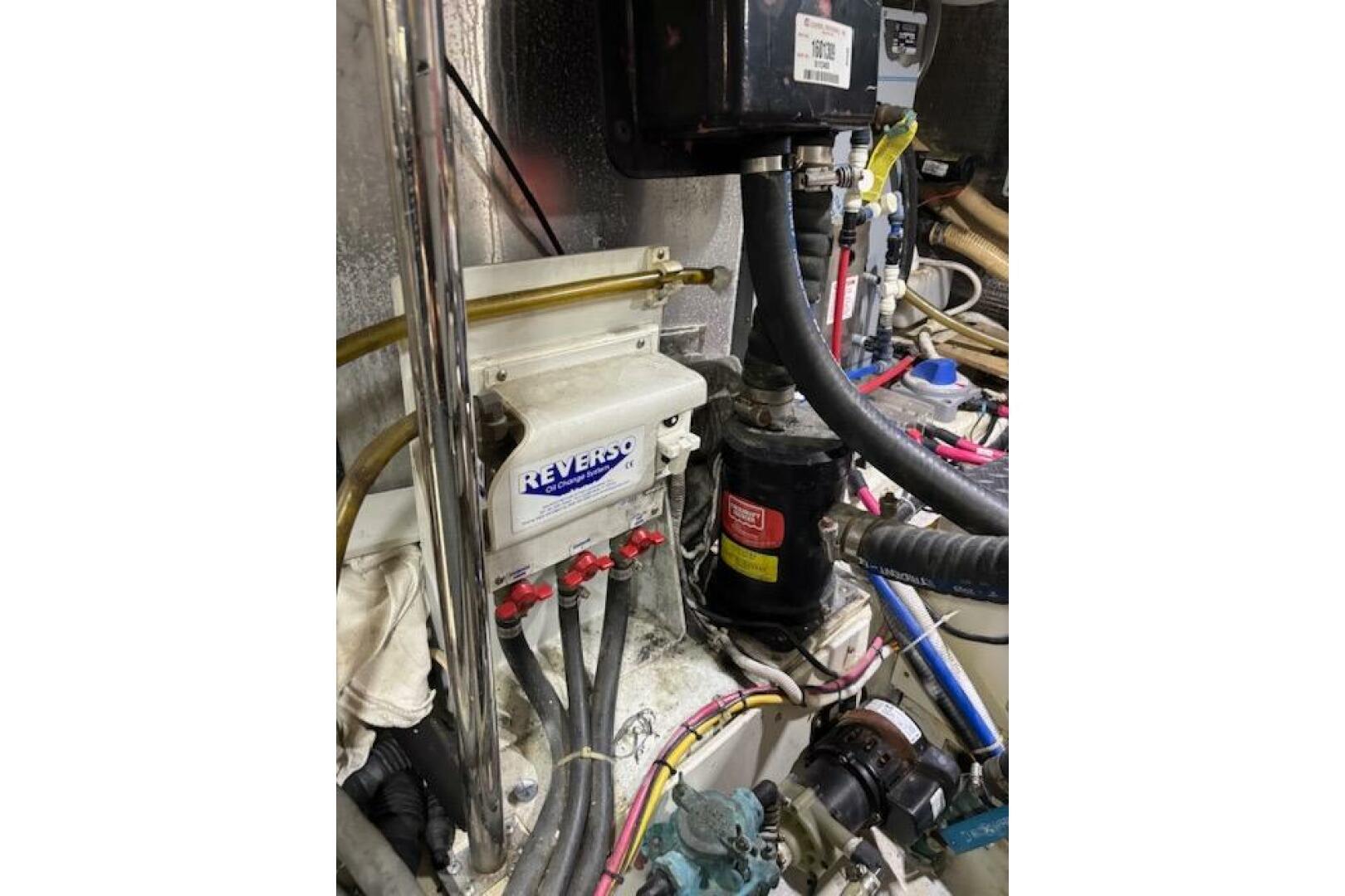 Engine room of 2004 Carver 466 Motor Yacht with Reverso oil 