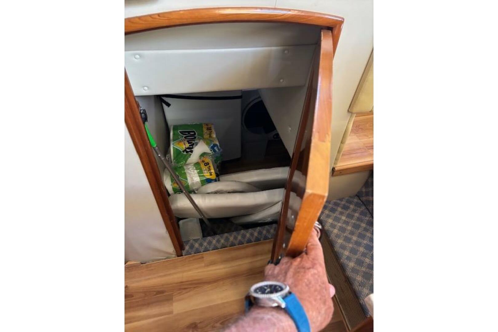 Storage compartment in 2004 Carver 466 Motor Yacht with clea