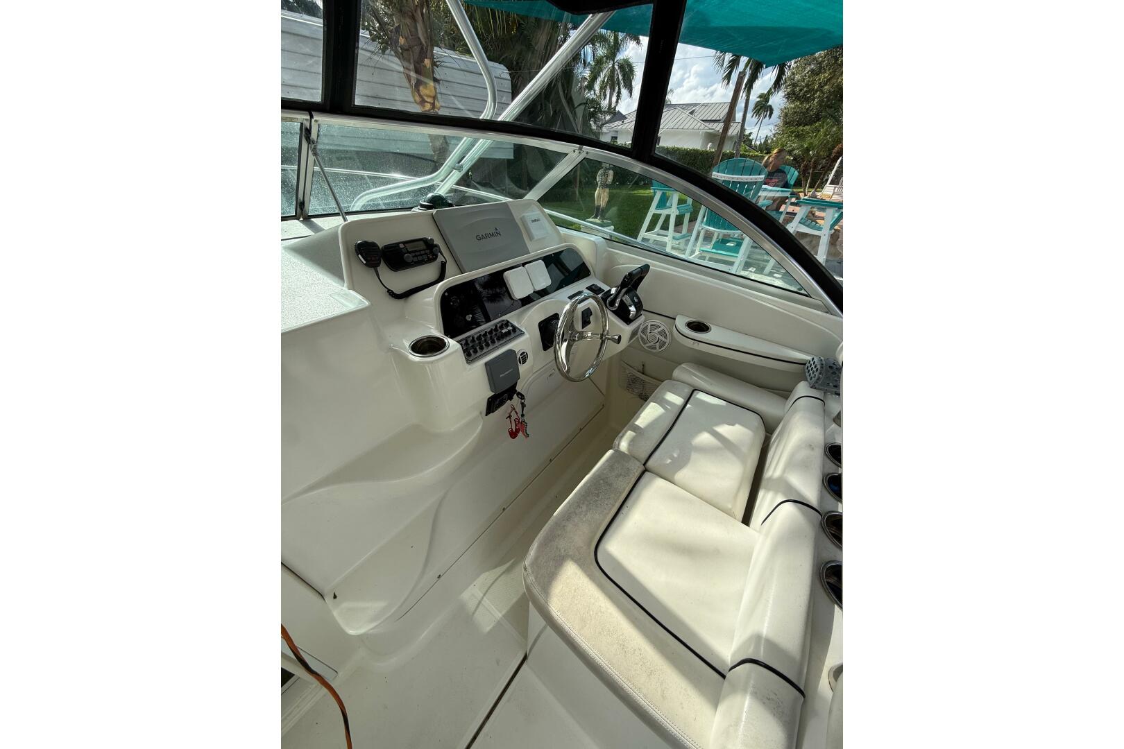 2002 Wellcraft 290 Coastal boat interior with steering wheel