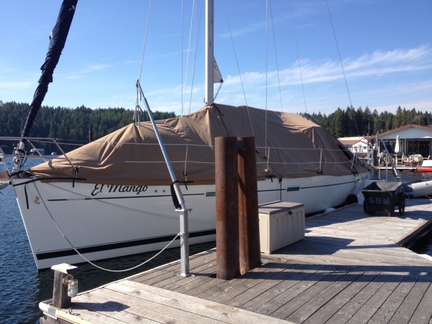 2007 Beneteau 393 sailboat docked with full cover