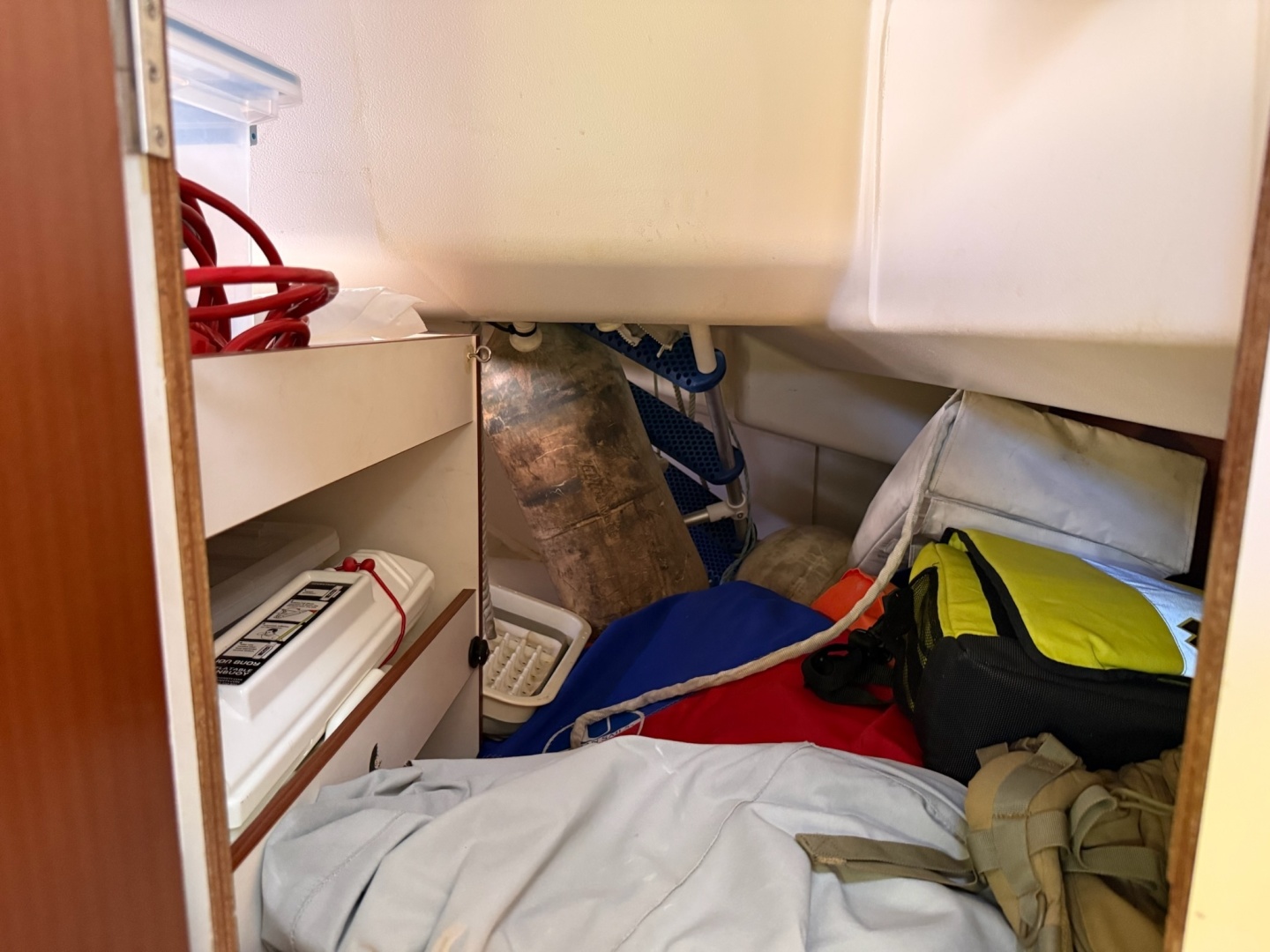 Storage space accessible from outside locker 