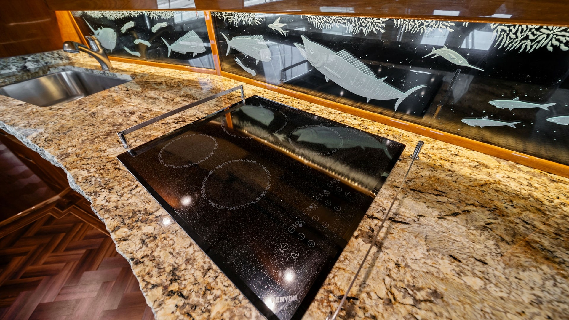 Galley with Cooktop and Artful Backsplash