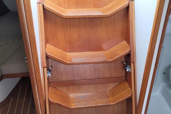 Harlequin companionway ladder and engine cowling.