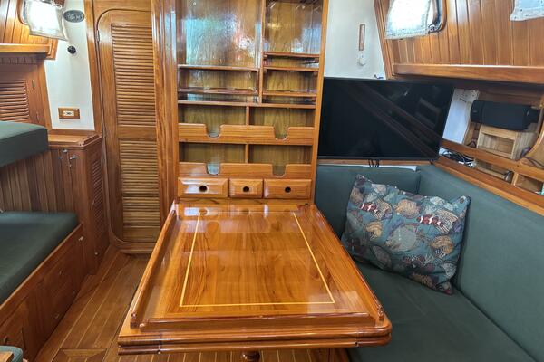 Salon table has foldout to port