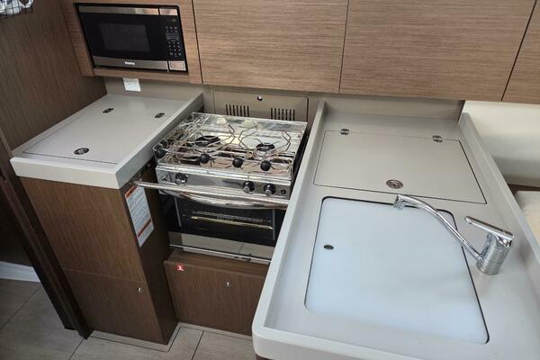 Galley with fridge/freezer, microwave, stove/oven, sink