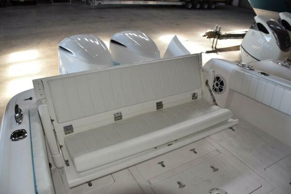 Rear Seat Opened, There Is A Receiver On Deck To Move Fiberglass Table Here If Wanted. Note Pop Up Cleats.