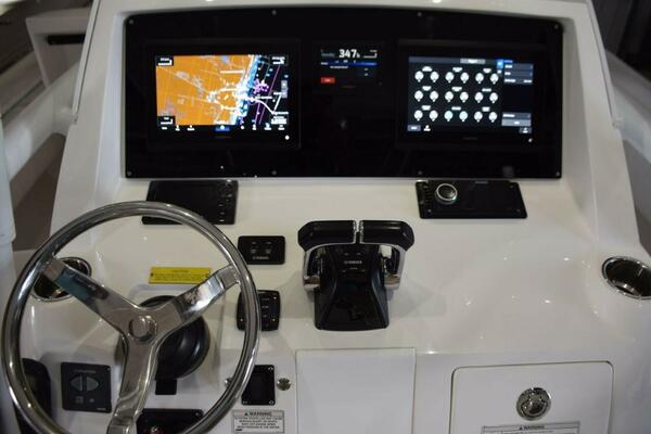 Dual Garmin 12 Inch Displays With Garmin Autopilot Between. Digital Switching For Boat Systems Via Garmin.