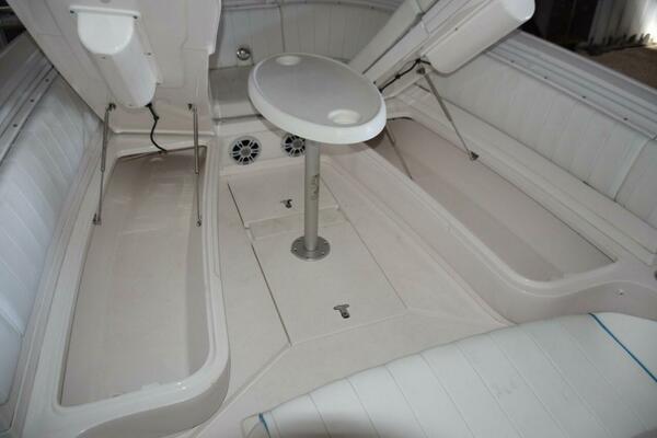 Larger Storage Compartments Accessed With Gas Shock Lifts Beneath Forward Seating Bases