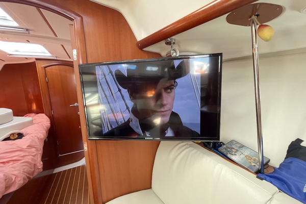 Interior of 2007 Beneteau 393 yacht with TV and cozy seating area