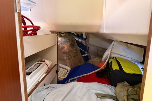 Storage space accessible from outside locker 