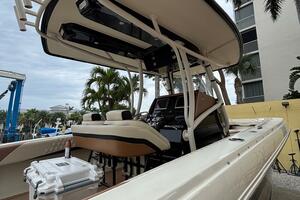 2013 Statement 35 Center Console boat with T-top, docked nea