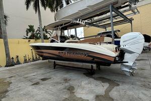 2013 Statement 35 Center Console boat on a dock with palm tr