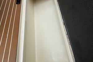 Open storage compartment on 2013 Statement 35 Center Console