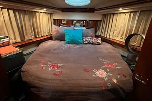 Luxurious bedroom in 2000 Carver 506 Motor Yacht with floral