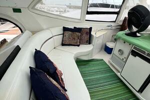 Interior of 2000 Carver 506 Motor Yacht with white seating a