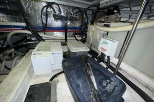 Engine room of 2000 Carver 506 Motor Yacht with various equi