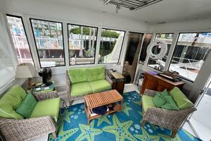 Interior of 2000 Carver 506 Motor Yacht with green seating a