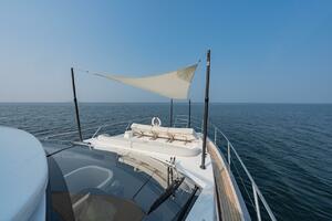 2023 Azimut Fly 53 yacht with sunshade, cruising on open sea